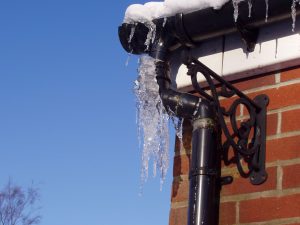 Frozen ice on roof gutter