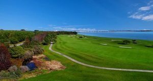 Aerial shot of golf course by the water