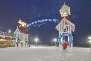 Ocean City, Maryland boardwalk snowing. Holiday events