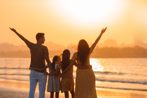 Hre Blog May Familyevents Family linking arms at sunset on beach