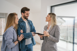 A male and female meeting with a woman in a suit