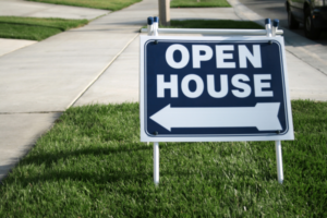 Hre Blog July26 Openhouse Open house sign in grass near sidewalk